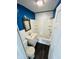 Cozy bathroom with a shiplap wall, a shower-tub combo and a modern sink with gold hardware at 128 E 36Th St, Anderson, IN 46013