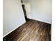 This bedroom features beautiful dark wood floors and a neutral color scheme at 128 E 36Th St, Anderson, IN 46013
