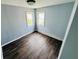 Cozy bedroom featuring hardwood floors, ample natural light and modern finishes at 128 E 36Th St, Anderson, IN 46013