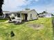 Quaint single-story home with tidy landscaping, featuring a covered entryway and cozy curb appeal at 128 E 36Th St, Anderson, IN 46013