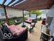 Relaxing backyard with a hot tub, covered patio, and comfortable seating at 12976 Walbeck Dr, Fishers, IN 46037