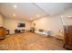 Spacious finished basement with wood-look floors, recessed lighting, and a comfortable seating area at 12976 Walbeck Dr, Fishers, IN 46037