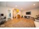 Large finished basement with durable wood-look flooring and convenient access to bathroom and stairs at 12976 Walbeck Dr, Fishers, IN 46037