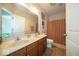 Well-lit bathroom featuring a double sink vanity, large mirror, and shower with a curtain at 12976 Walbeck Dr, Fishers, IN 46037