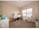 Versatile bedroom space suitable for a playroom or study, filled with natural light and neutral carpet at 12976 Walbeck Dr, Fishers, IN 46037