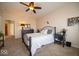 Inviting bedroom featuring soft carpet, ceiling fan, and comfortable furnishings at 12976 Walbeck Dr, Fishers, IN 46037
