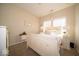 Charming bedroom with two windows, carpet, and a well decorated vintage bed and side tables at 12976 Walbeck Dr, Fishers, IN 46037