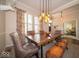 Spacious dining room featuring an open floor plan, a wooden table, and natural light from the windows at 12976 Walbeck Dr, Fishers, IN 46037