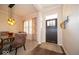 A dining room with an eye-catching light fixture, a wooden table, and elegant window shutters at 12976 Walbeck Dr, Fishers, IN 46037