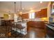 Spacious kitchen features an island with bar seating and wooden cabinets at 12976 Walbeck Dr, Fishers, IN 46037