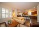 Open-concept living area features hardwood floors and many windows at 12976 Walbeck Dr, Fishers, IN 46037