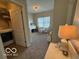 Playroom with laundry area featuring a toy table, storage shelves and natural light at 12976 Walbeck Dr, Fishers, IN 46037