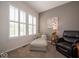 Cozy sitting area with comfortable armchairs, natural light, and neutral wall colors at 12976 Walbeck Dr, Fishers, IN 46037