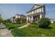 A street view showcasing the well-maintained lawns and inviting exteriors of the neighborhood homes at 12976 Walbeck Dr, Fishers, IN 46037