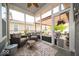 Cozy sunroom with lots of light and chairs perfect for relaxation or entertaining guests at 12976 Walbeck Dr, Fishers, IN 46037
