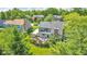 Home backyard showcasing patio area, fire pit, professional landscaping, and mature trees at 13304 Landwood Dr, Fishers, IN 46037