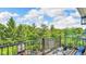 Relaxing balcony overlooking a green yard features a grill, seating, and potted plants, perfect for outdoor enjoyment at 13304 Landwood Dr, Fishers, IN 46037