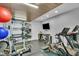Basement home gym with wood ceiling and modern exercise equipment and weights at 13304 Landwood Dr, Fishers, IN 46037
