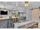 This finished basement offers a dining area, kitchenette, and living space behind a barn door at 13304 Landwood Dr, Fishers, IN 46037
