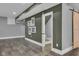 Spacious basement area with tile flooring and a charming bathroom with a sliding barn door at 13304 Landwood Dr, Fishers, IN 46037