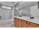 Simple bathroom with a shower-tub combo, double vanity, and tile floor at 13304 Landwood Dr, Fishers, IN 46037