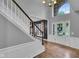 Elegant foyer featuring staircase, wood floors, chandelier, and grand entrance at 13304 Landwood Dr, Fishers, IN 46037
