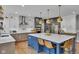 Stylish kitchen featuring a large island, modern appliances, and two-tone cabinetry at 13304 Landwood Dr, Fishers, IN 46037