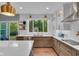 Modern kitchen with white countertops, stainless steel appliances, and bright natural light at 13304 Landwood Dr, Fishers, IN 46037
