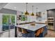 Modern kitchen with a large island, pendant lighting, and stainless steel appliances at 13304 Landwood Dr, Fishers, IN 46037