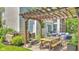 Inviting outdoor patio area with a pergola and dining table at 13304 Landwood Dr, Fishers, IN 46037