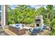Inviting outdoor living space with stone fireplace, TV, and comfortable seating at 13304 Landwood Dr, Fishers, IN 46037