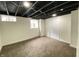 This is a finished basement featuring an exposed ceiling, carpet, and a closet for extra storage space at 1429 Udell St, Indianapolis, IN 46208