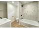 Modern bathroom with marble tiled shower, sleek vanity, and contemporary fixtures, offering a spa-like experience at 1429 Udell St, Indianapolis, IN 46208
