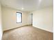 Bright, carpeted bedroom with ample natural light, showcasing a peaceful and inviting space for relaxation and rest at 1429 Udell St, Indianapolis, IN 46208
