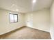 Cozy bedroom features plush carpeting, ample natural light, and a modern door for comfortable living at 1429 Udell St, Indianapolis, IN 46208