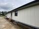 Exterior side view of home featuring vertical siding, an entrance, and windows at 1429 Udell St, Indianapolis, IN 46208