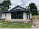 Charming renovated bungalow showcasing new siding, deck and manicured lawn, inviting comfort and modern curb appeal at 1429 Udell St, Indianapolis, IN 46208