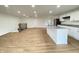 Bright and open living space with hardwood floors, a modern island kitchen, and plenty of natural light at 1429 Udell St, Indianapolis, IN 46208