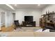 Cozy basement features a fireplace, shelving, television, and comfortable seating at 1497 Maple Ridge Ct, Columbus, IN 47201