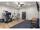 Home gym features treadmill, free weights, hardwood flooring, and exercise equipment at 1497 Maple Ridge Ct, Columbus, IN 47201