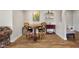 Basement area with bar stools and table, along with shelving and a painting at 1497 Maple Ridge Ct, Columbus, IN 47201
