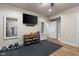 Home gym setup with tv, mirrors, weights, and hardwood floor at 1497 Maple Ridge Ct, Columbus, IN 47201