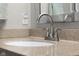 Bathroom close up features a sink and faucet with a granite countertop at 1497 Maple Ridge Ct, Columbus, IN 47201