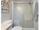 Well-lit bathroom equipped with a shower and coordinated finishes at 1497 Maple Ridge Ct, Columbus, IN 47201