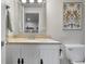 Stylish bathroom featuring a modern vanity, granite countertop, and contemporary fixtures at 1497 Maple Ridge Ct, Columbus, IN 47201