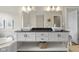 Bathroom vanity with dual sinks, sleek black counters and under shelf basket storage at 1497 Maple Ridge Ct, Columbus, IN 47201