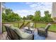 Outdoor deck seating area with patio furniture and green lawn view at 1497 Maple Ridge Ct, Columbus, IN 47201
