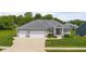Attractive single-Gathering home with a three-car garage, a well-manicured lawn, and stone accents at 1497 Maple Ridge Ct, Columbus, IN 47201