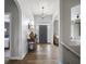 Spacious foyer with hardwood floors and modern lighting fixtures, creating an inviting ambiance at 1497 Maple Ridge Ct, Columbus, IN 47201