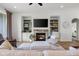 Spacious living room featuring a stone fireplace and built in shelving, perfect for entertaining at 1497 Maple Ridge Ct, Columbus, IN 47201